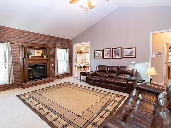 Spacious Great Room with gas fireplace and vaulted ceiling