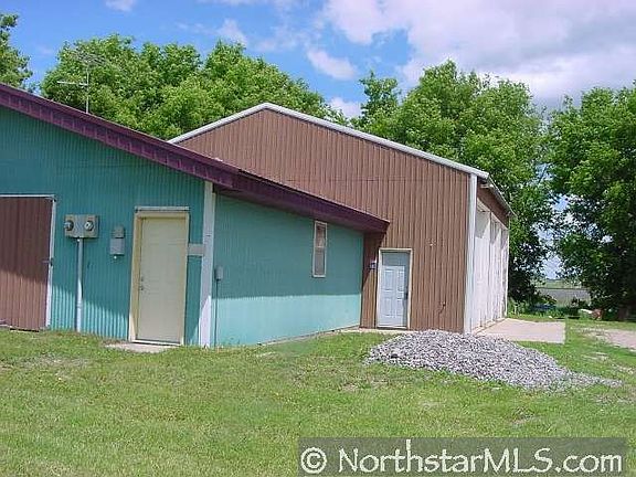 Older building with paint booth, and vehicle life. Water and Sewer 