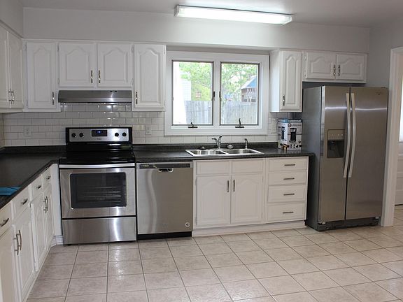 Updated eat-in kitchen with stainless steel appliances.