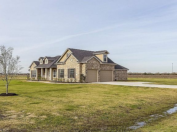 Located on a corner lot with side entry drive from the side street.