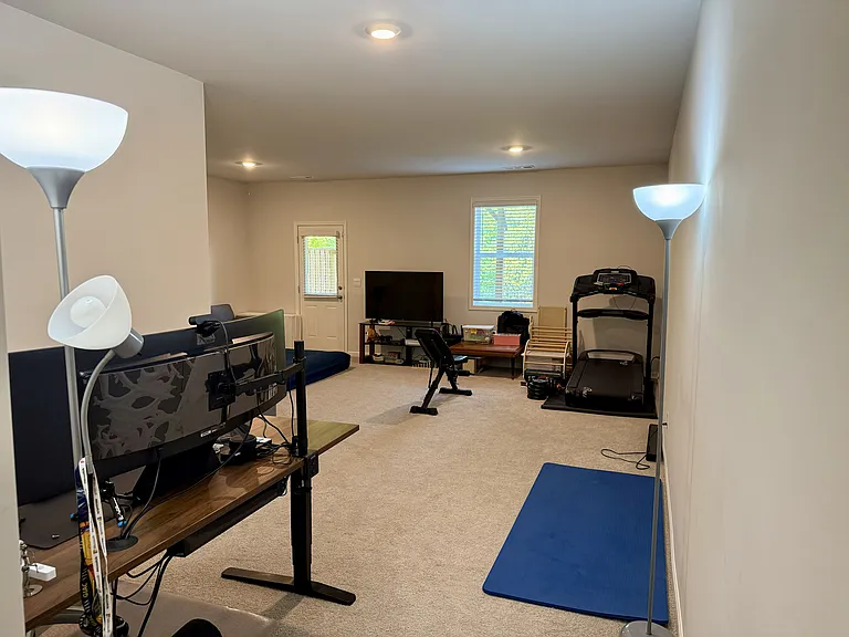 Fully finished basement with access to patio and backyard