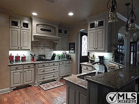 The kitchen is a chef's dream with under the cabinet lighting, g