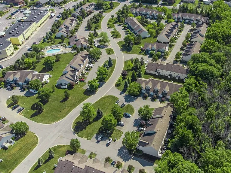 Exterior aerial view of Webster Woods townhomes neighborhood looking northeast