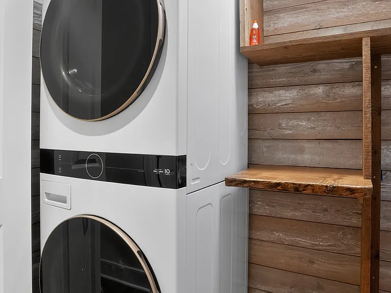 laundry area with custom wood storage