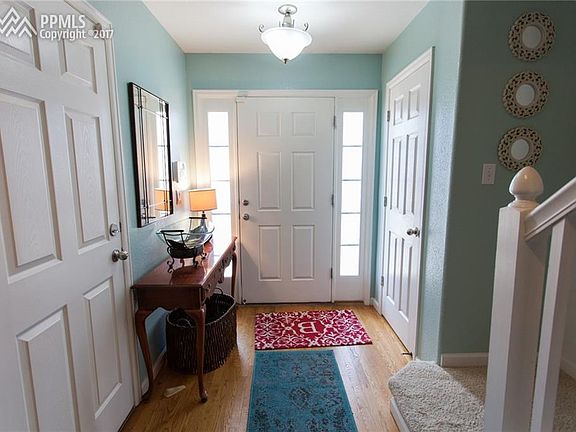 Spacious entry with coat closet and access to attached garage.