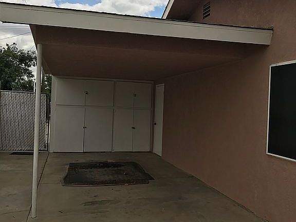 Carport w/ lrge storage area