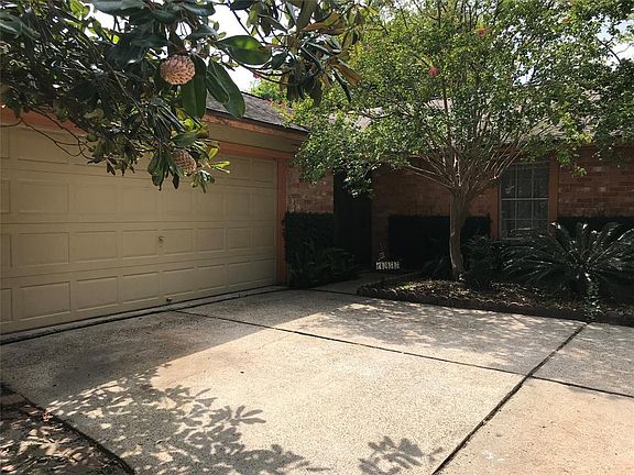 Welcome home to your peaceful 1 story home with brick and wood exterior shaded by mature trees.