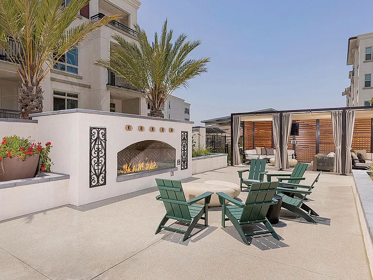 Pool deck fireplace and cabanas