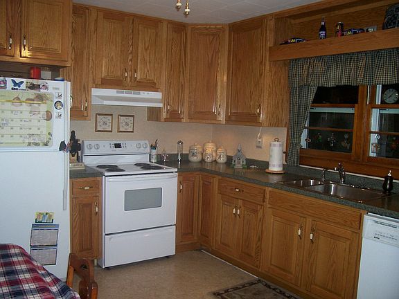 Everything updated in kitchen except flooring. More cabinets to the right.