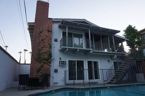 Pool-side of the building w/ private patio