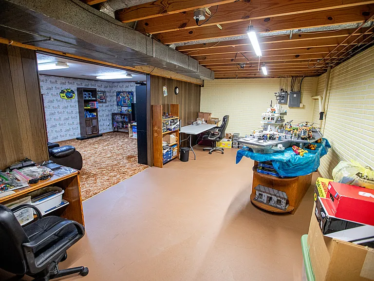 Basement Storage Area - Family Room carpeted area on left