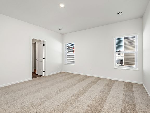 The master bedroom is spacious with access its own bathroom