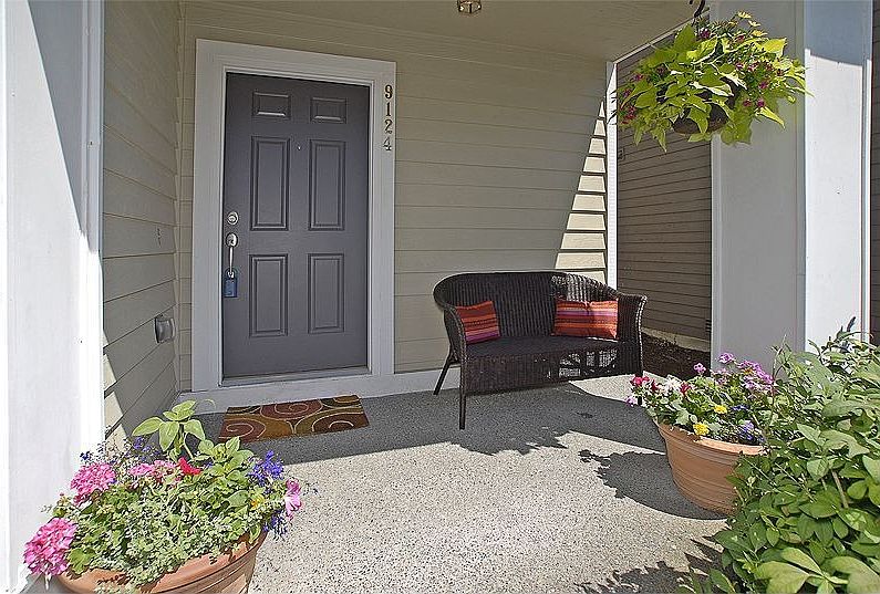 The covered front porch is ideal for relaxing, even on a rainy evening.