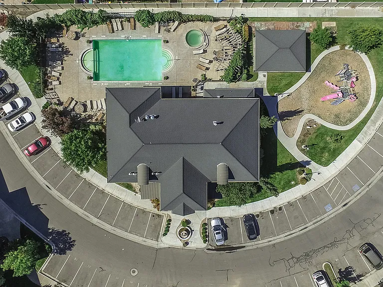 Aerial view of the clubhouse pool / hot tub, and the attached park / play area.