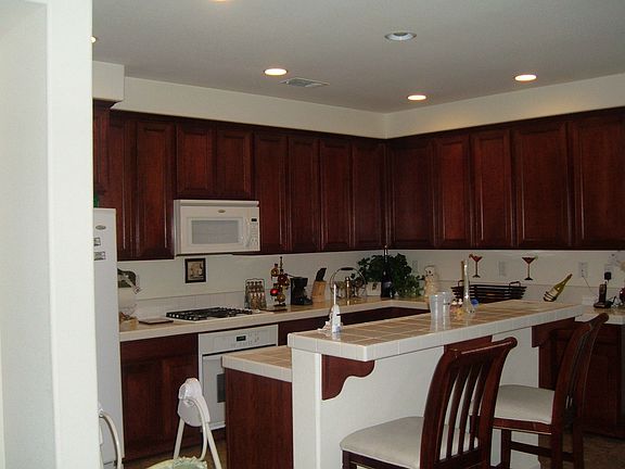 Kitchen features Cherrywood Cabinets/Tile Countertops