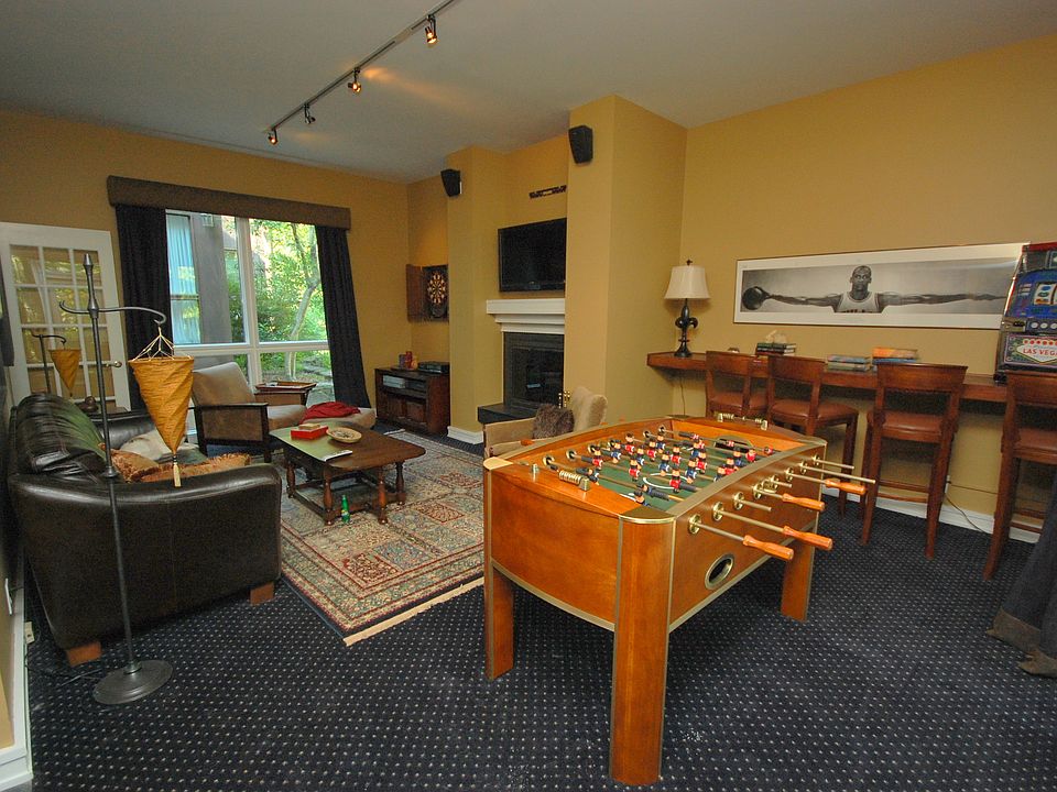 Lovely living area with beautiful skylights and built-in fireplace.