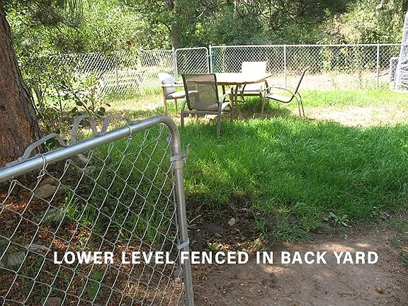 Lower level has it's own fenced in 
back yard.