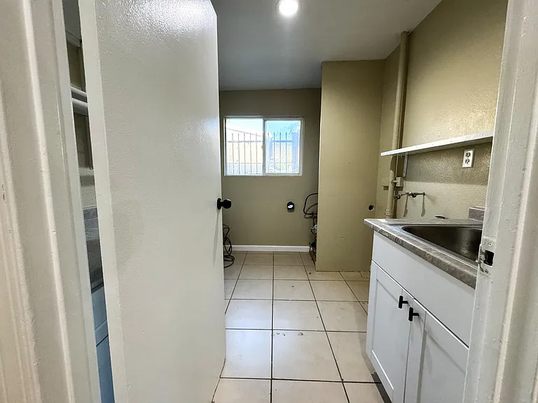 HALLWAY VIEW TO LAUNDRY ROOM