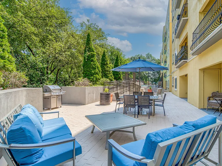 Outdoor patio with grills and plentiful seating