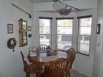 Convenient Dining Area with ceramic flooring adjoins the Kitchen and Living Room.
