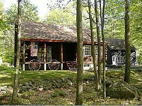Outdated  photo of log cabin