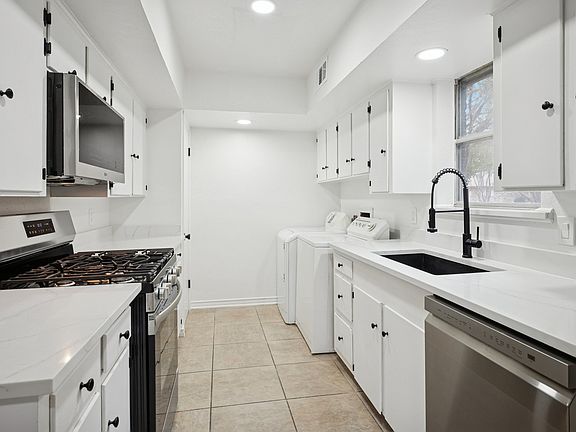 Completely redone kitchen features all new appliances, including washer and dryer!