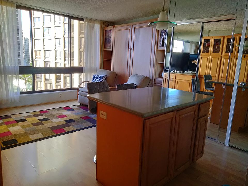 Kitchen island to living room with 2 lazy boy chairs