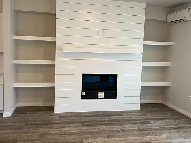 Gas Fire Place, Built in Book Shelves. Air Conditioning.
