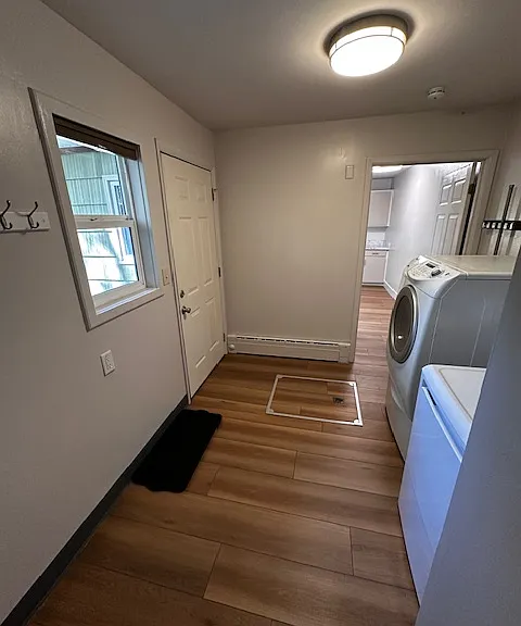 Laundry/storage and back door to side yard