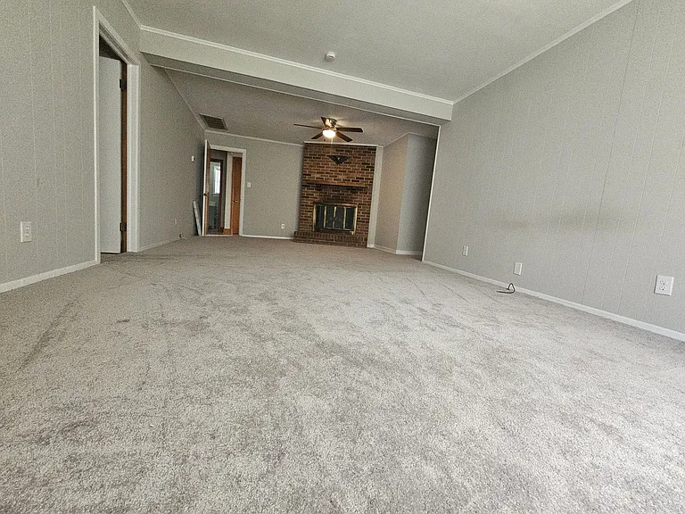 25x13 ft Family room with new paint, ceiling fan & carpet