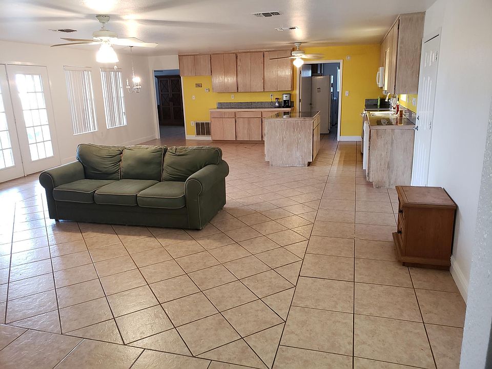Open floor plan with master bedroom on one side and other two bedrooms opposite side.