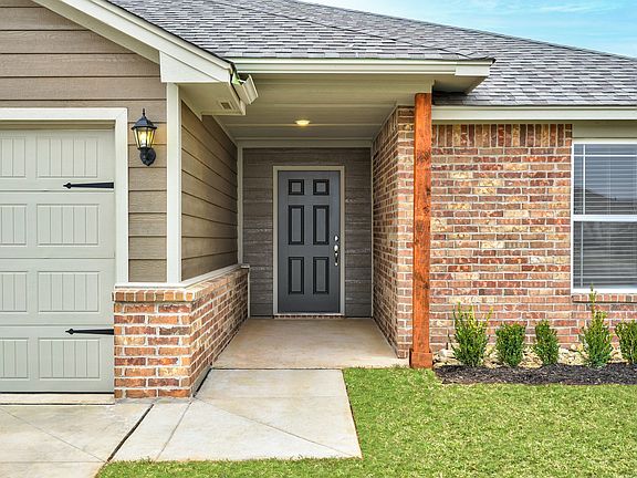 This home comes complete with a charming covered front entry way.