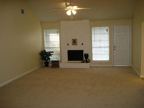 FORMAL LIVING ROOM WITH NEW CARPET ,NEW CEILING FANS AND NEWLY PAINTED