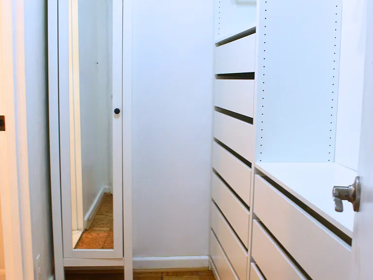 Secondary Walk-In Closet with Built-In Storage