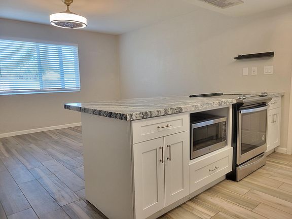 Kitchen opens up to large dining room