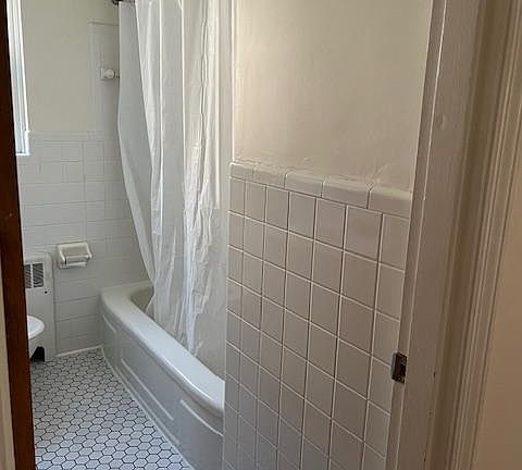 Remodeled bathroom with tile floors