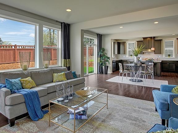 Family room to kitchen. Photo not of actual home - may contain optional features.