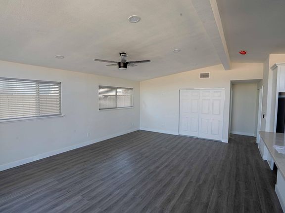 Very large living room next to kitchen/dining