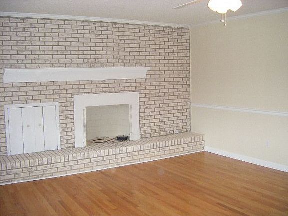 brick fireplace in living room
