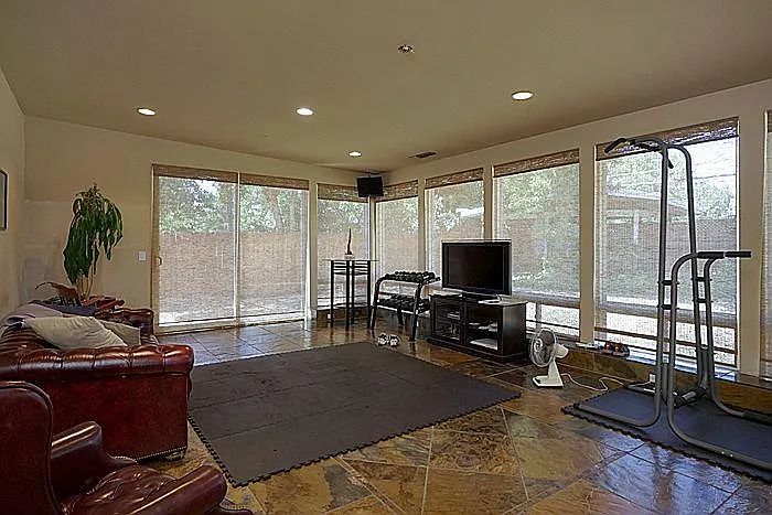 This room was built as a game room (pool table, etc.), but has been used as a gym, gaming room (with a 70" TV), and more
