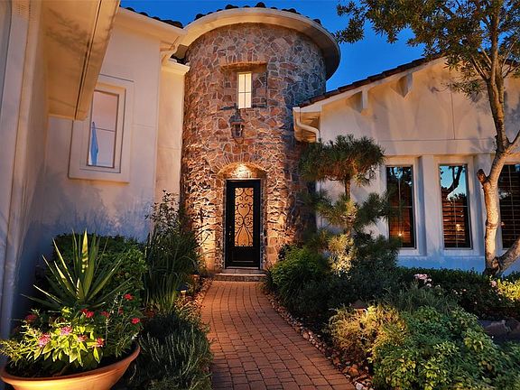 THE LANDSCAPING IS ABSOLUTE PERFECTION - CHECK IT OUT - The abundance of greenery and annuals are evident to the loving care & pride these sellers have taken to preserve the home. Front and back mowing and trimming are provided by the HOA and include