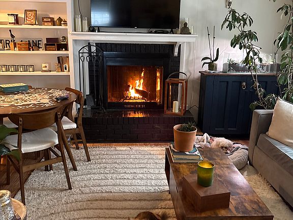 Family room with wood burning fireplace opened 
 to kitchen