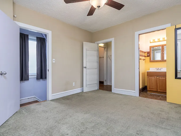 3rd bedroom on 2nd floor at top of stairs. Walk-in closet. Half bath.