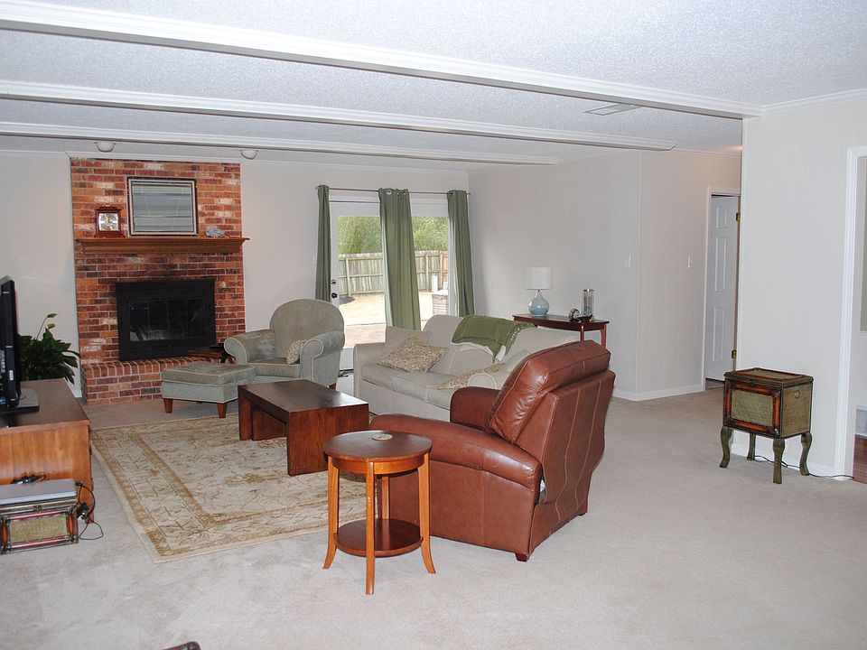 Very large great room with wonderful light, neutral colors, almost new carpet.