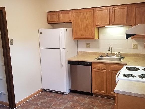 Note: Door opened to show shelving in kitchen pantry