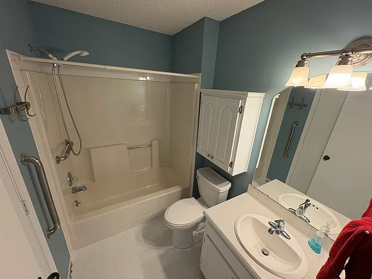Refreshed first floor bathroom with new toilet and flooring.