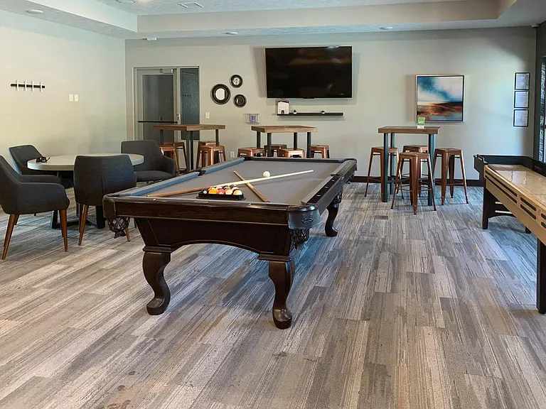 Enjoy a game of pool or shuffleboard with friends in a stylishly designed clubhouse lounge.