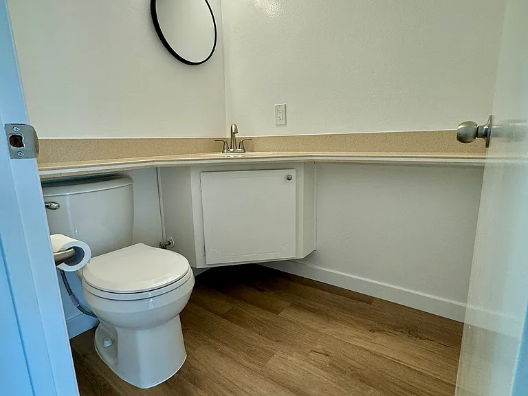 Downstairs guest bath with new toilet, fixtures, paint and flooring!