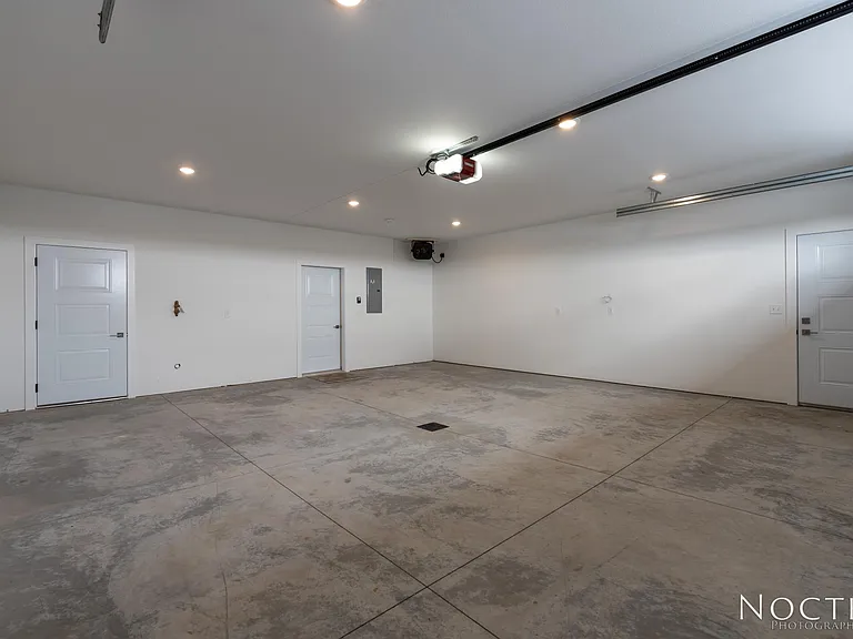 Extra large garage. (Photo of another unit with similar finishes and quality.)