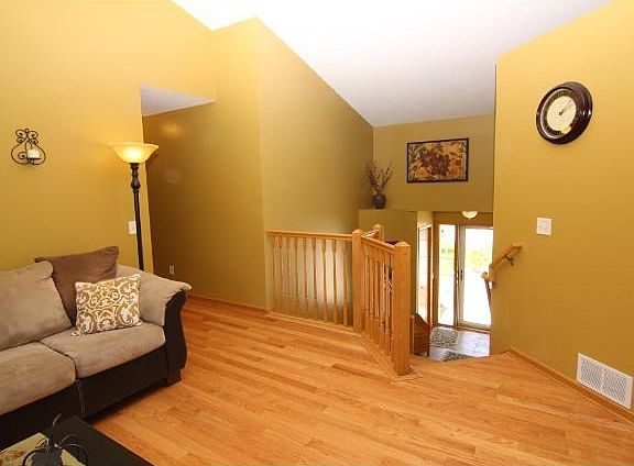 Vaulted ceilings abound! The entryway is oversized, and welcomes visitors to the inviting home!